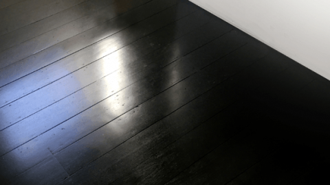 black stained jarrah floorboards